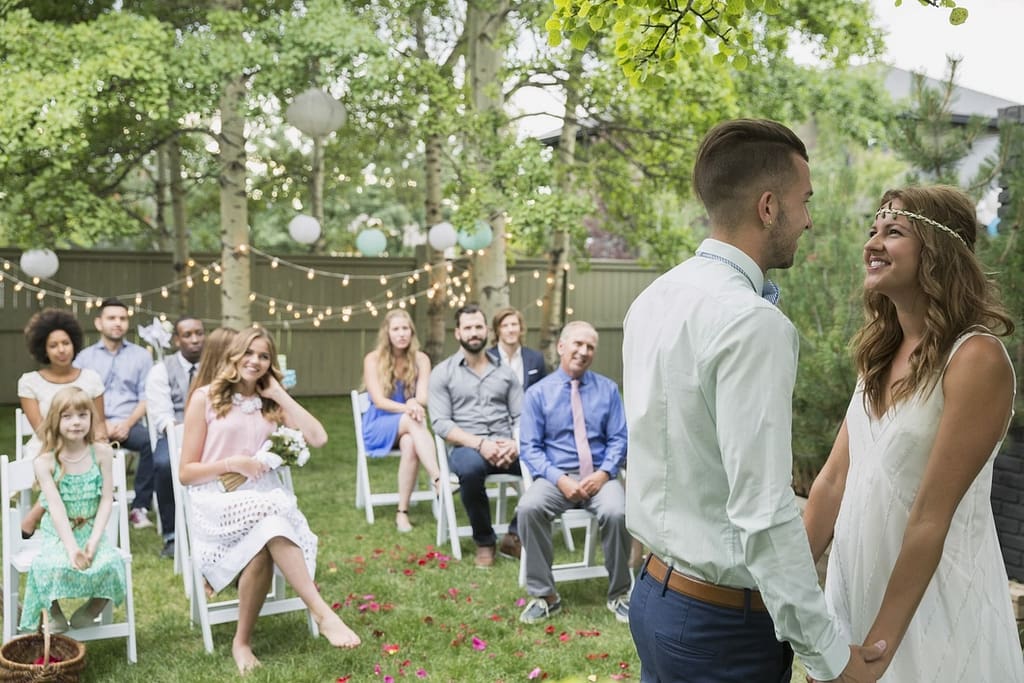 Couple tie the knot in their back garden due to restrictions on guest numbers as a result of the pandemic.