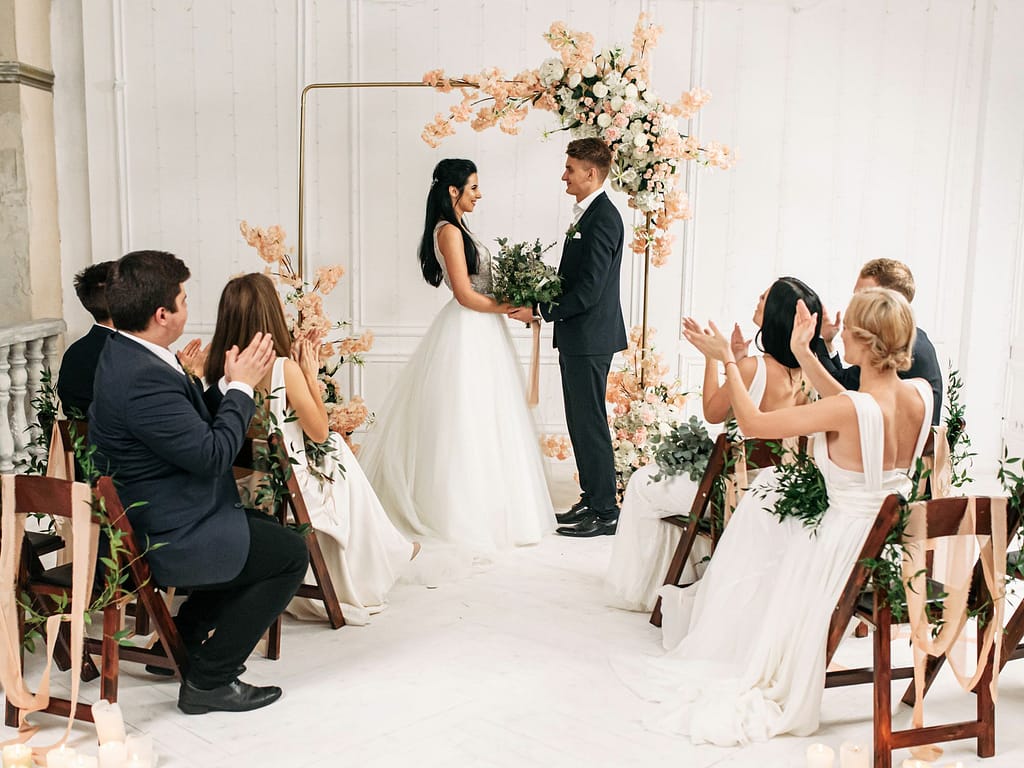 Couple tie the knot in front of their guests at their intimate celebration.